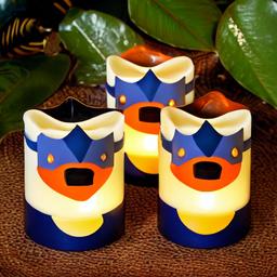 Animal shaped candles designed with S.P.E.W. badge pattern set against a jungle